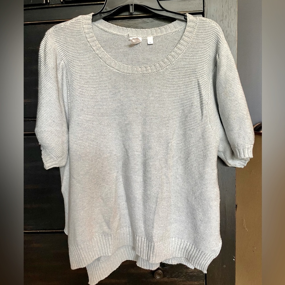 Light blue short sleeve sweater. No stains or flaws